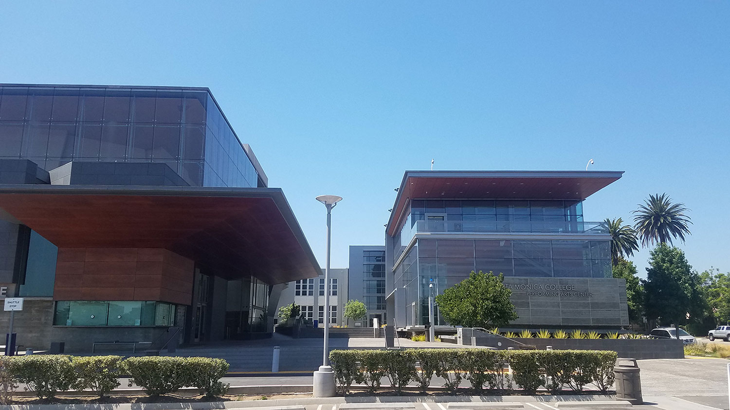 The EPIC conference will occupy two buildings on campus: the Eli and Edythe Broad Stage building and the East Wing building. Seen from the parking lot, the Broad Stage is on the left and the East Wing on the right, with a courtyard in between.