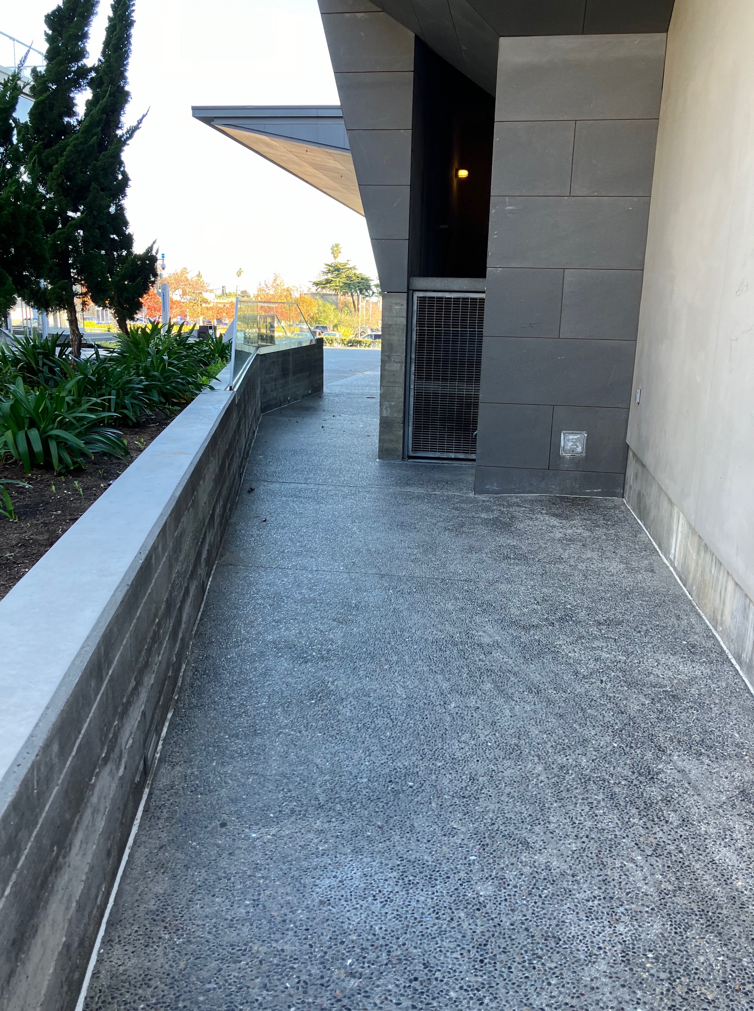 The entrance to Eli and Edythe BroadStage building has steps on the right, and a ramp on the left.  